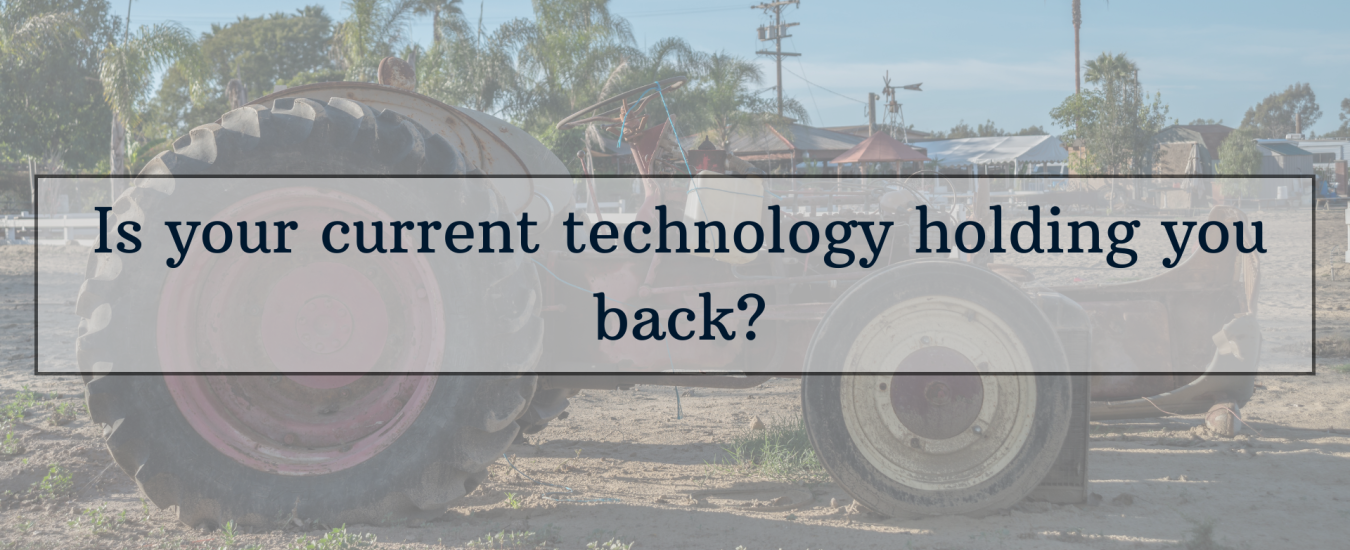 A faded tractor in a field with the text overlay: "Is your current technology holding you back?.